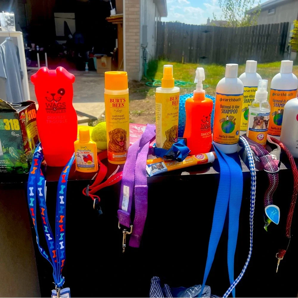 Leashes shampoo conditioner and dog bowls and toys